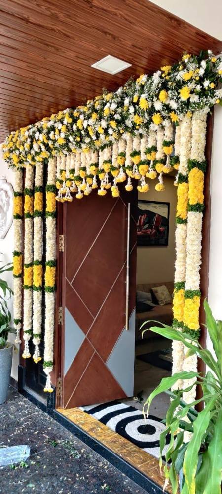 Entrance decorated with jasmine and chrysanthemum garlands