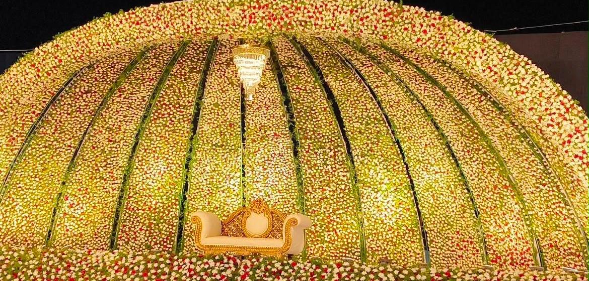 Floral dome reception stage decorated by The Grand Affair by Naveen